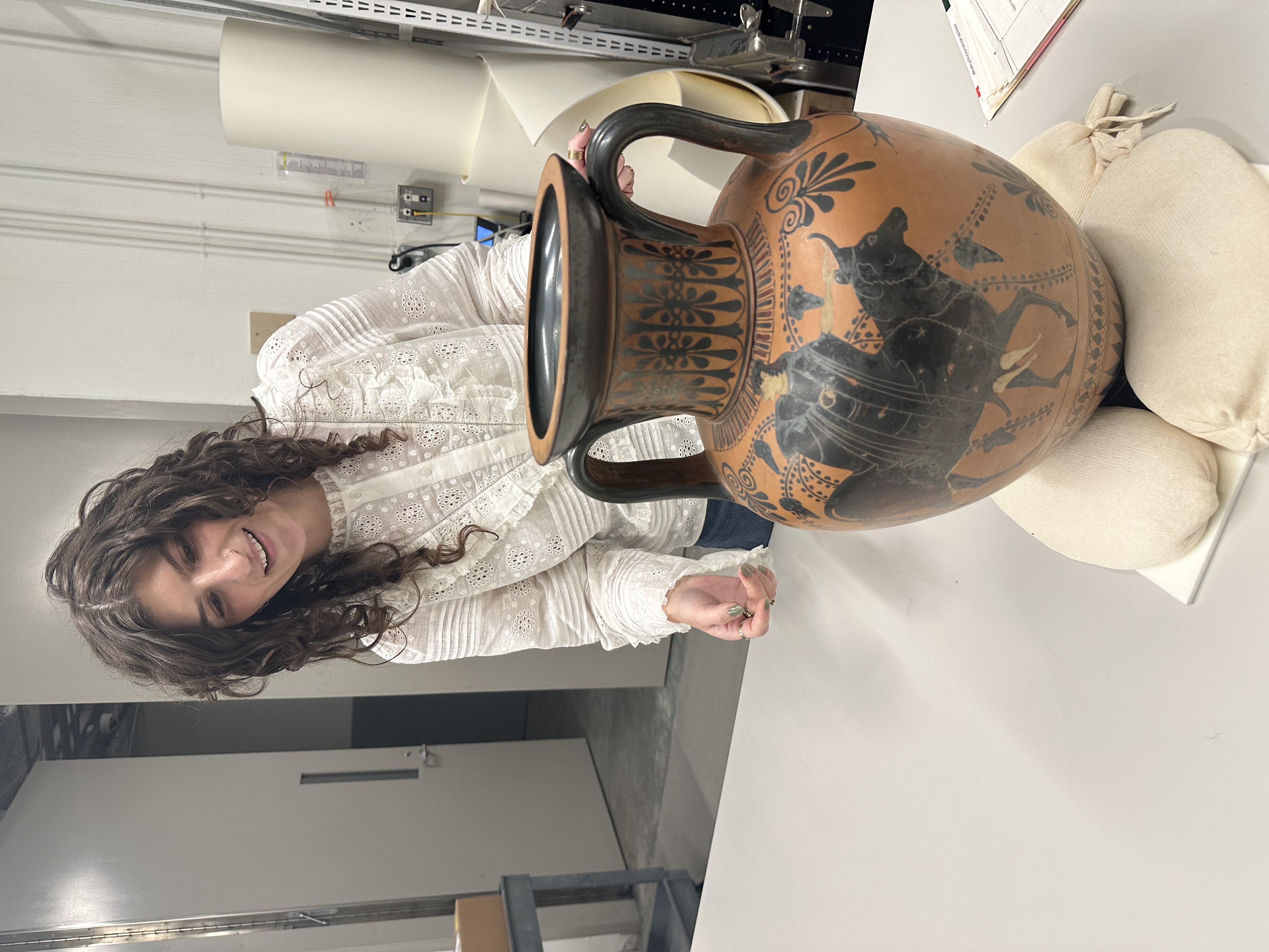 Duke Law student Nicole Braun JD '27 and the ancient Greek amphora she has been researching.