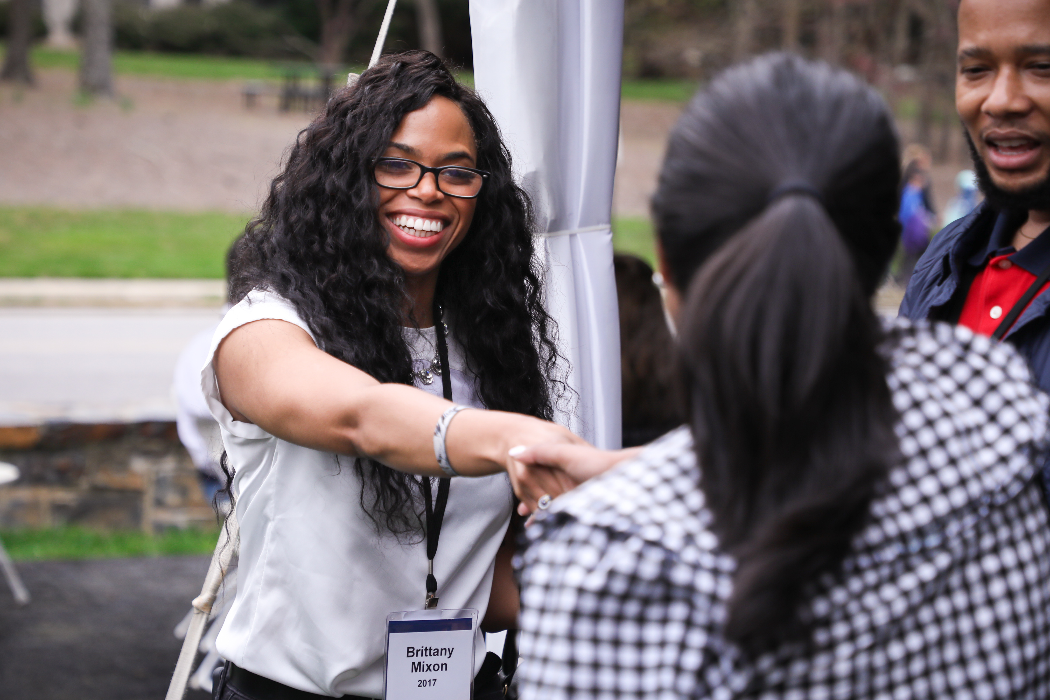 Two people greeting each other at Reunion