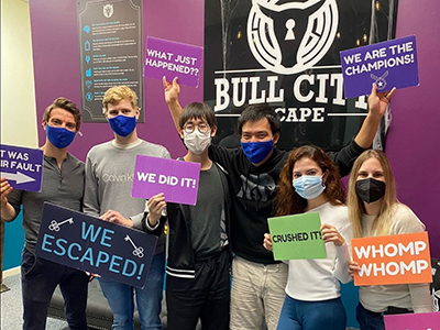 Students posing after finishing escape room