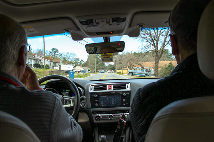 Professors Schroeder and Clotfelter on their Meals on Wheel route.