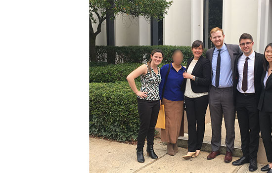 clinic members standing in front of courthouse