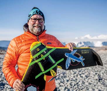 David Johnston, director of Duke University’s Marine Robotics & Remote Sensing Lab, holds a fixed wing drone used to study penguins in Antarctica.