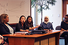 Student presenter at podium