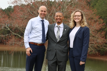 Clinical Professor Jamie Lau '09, Anthony Willis, Adelyn Curran '22 on the day Willis was released