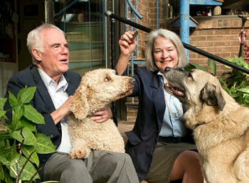 Bill Reppy Jr. and Juliann Tenney ’79 with two of their three resuce dogs